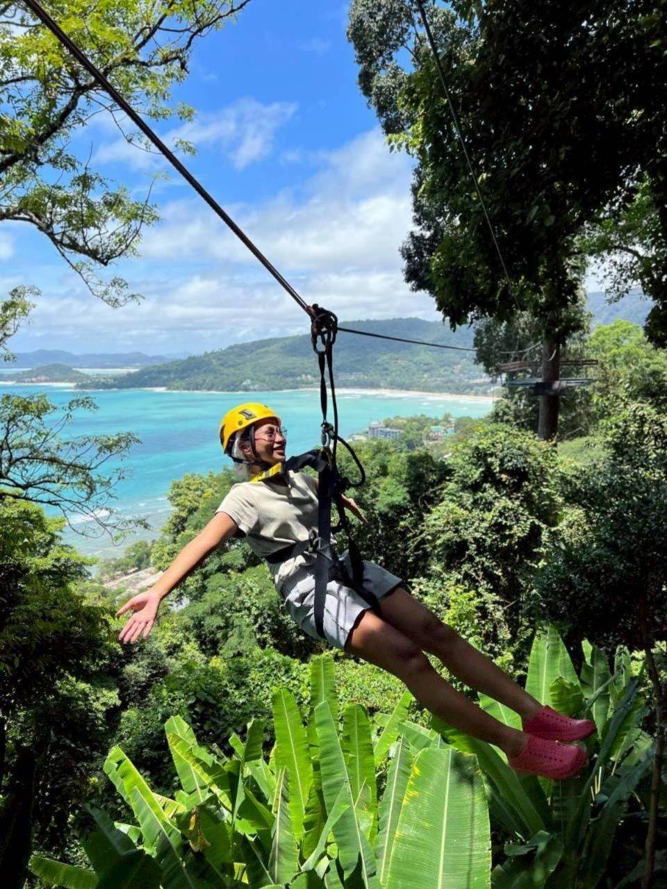 Flying over the jungle with the sea behind