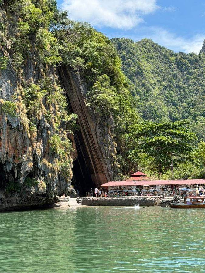 Limestone cliffs and emerald water in Phang Nga Bay